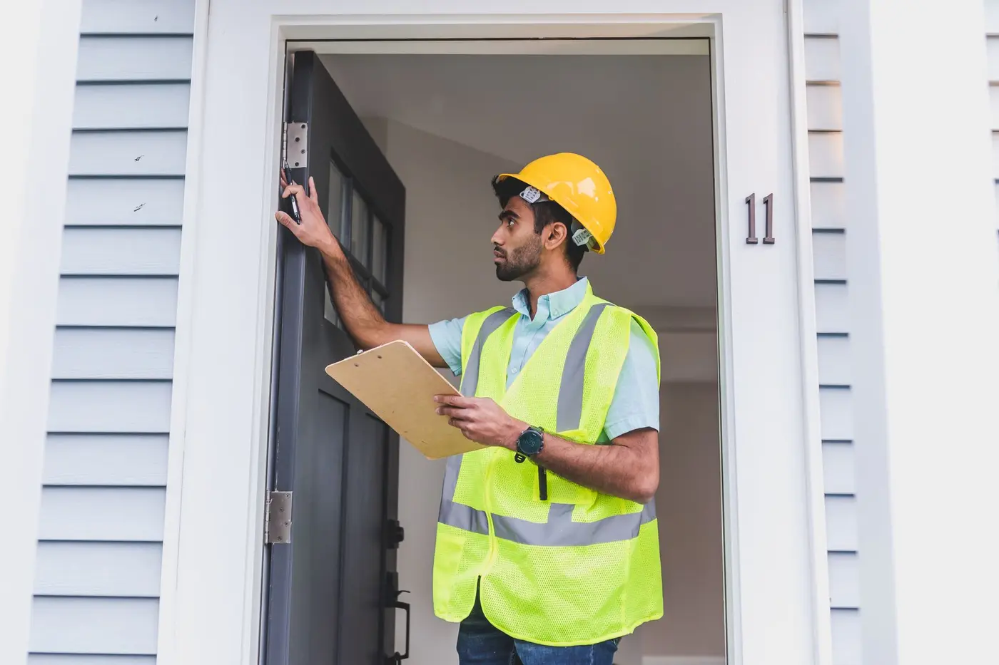 Property inspector carefully checking a residential entry point